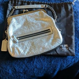 Silver Coach clutch with expansion zipper